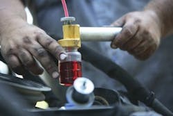 1654665502423 Drawing Coolant Sample Close Up Of Bottle C348280 1654665502423 Drawing Coolant Sample Close Up Of Bottle C348280