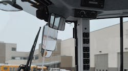 A forward-view mirror in front of the cab ceiling points down at the bucket area to maximize visibility to the front of the bucket. A forward-view mirror in front of the cab ceiling points down at the bucket area to maximize visibility to the front of the bucket.