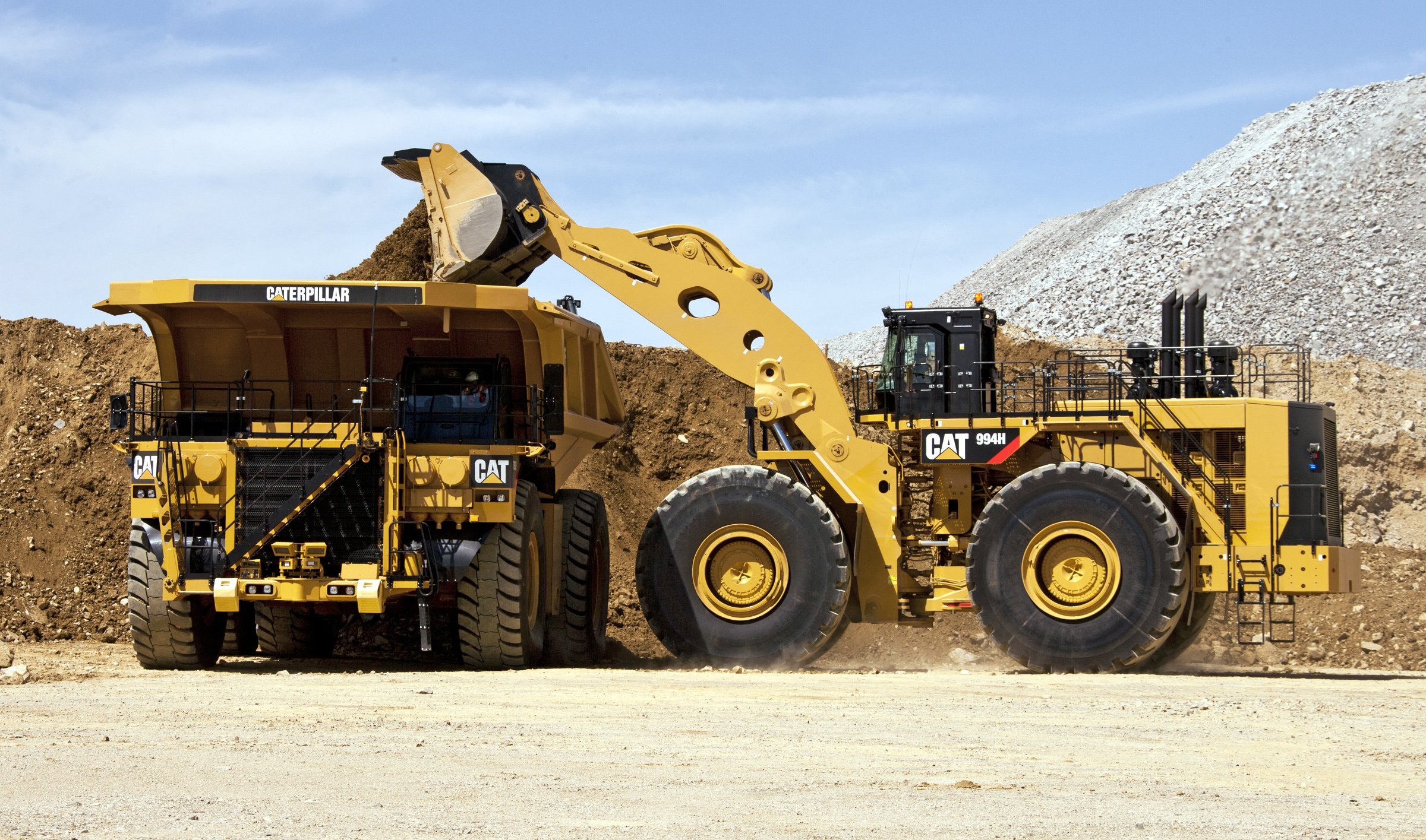 1654786481682 Cat 994h Wheel Loader Loads Cat 793f Truck
