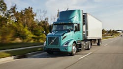 1654814250142 Volvo Vnr Electric 4x2 With Reefer Trailer Driver Side View On The Road 1654814250142 Volvo Vnr Electric 4x2 With Reefer Trailer Driver Side View On The Road