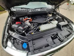 Shrouding, plumbing, and wiring hide the twin-turbo V-6 that’s backed by an electric motor. Only the PowerBoost name and orange-wrapped wiring (carrying 400 volts in this system) hint that this is a fuel-saving and performance-enhancing hybrid powertrain. Shrouding, plumbing, and wiring hide the twin-turbo V-6 that’s backed by an electric motor. Only the PowerBoost name and orange-wrapped wiring (carrying 400 volts in this system) hint that this is a fuel-saving and performance-enhancing hybrid powertrain.