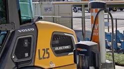 An electric machine charging in a CALTRANS equipment yard.
