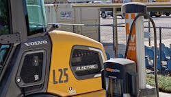An electric machine charging in a CALTRANS equipment yard. An electric machine charging in a CALTRANS equipment yard.