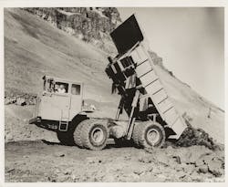 When introduced in 1964, the all-wheel-drive, 45-ton capacity International 180 Payhauler was unlike anything else on the market. Judging by the terrain behind it, the site is probably the I-80 and Union Pacific Railroad relocations for John Day Dam on the Oregon bank of the Columbia River. When introduced in 1964, the all-wheel-drive, 45-ton capacity International 180 Payhauler was unlike anything else on the market. Judging by the terrain behind it, the site is probably the I-80 and Union Pacific Railroad relocations for John Day Dam on the Oregon bank of the Columbia River.