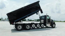 (Inset) A typical Class 8 truck has 35 to 45 microchips, and they are at the top of the list of shortages hobbling automotive manufacturing, observers say.In early June, this 122SD dumper (left) was the only new truck available for sale on Fyda Freightliner’s lot near Columbus, Ohio. It sold fast, the dealer says. The normal wait for a new construction truck can be two years.