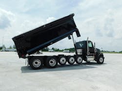(Inset) A typical Class 8 truck has 35 to 45 microchips, and they are at the top of the list of shortages hobbling automotive manufacturing, observers say.In early June, this 122SD dumper (left) was the only new truck available for sale on Fyda Freightliner’s lot near Columbus, Ohio. It sold fast, the dealer says. The normal wait for a new construction truck can be two years. (Inset) A typical Class 8 truck has 35 to 45 microchips, and they are at the top of the list of shortages hobbling automotive manufacturing, observers say.In early June, this 122SD dumper (left) was the only new truck available for sale on Fyda Freightliner’s lot near Columbus, Ohio. It sold fast, the dealer says. The normal wait for a new construction truck can be two years.