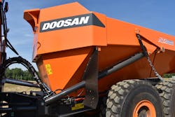 The deeper, sloping front section of the dump body helps keep load distribution toward the center of the truck. Note the stainless-steel cylinder on the left that transfers the heat from engine exhaust into the dump body. The deeper, sloping front section of the dump body helps keep load distribution toward the center of the truck. Note the stainless-steel cylinder on the left that transfers the heat from engine exhaust into the dump body.