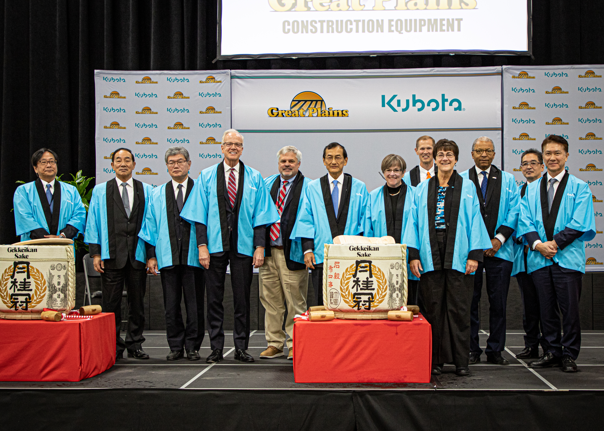 From left: Katsuhiko Yukawa, Kubota General Manager of Construction Machinery Division; Yuji Tomiyama, Kubota Deputy General Manager of Farm and Industrial Machinery Consolidated Division; Nobuyuki Ishii, Kubota General Manager of the Farm and Industrial Machinery Strategy and Operations Headquarters; Jerry Moran, U.S. Senator; Chris Collins, Great Plains Mfg. VP Operations; Yuichi &ldquo;Ken&rdquo; Kitao, Kubota President and Representative Director; Laura Kelly, Kansas State Governor; David Disberger, Great Plains Mfg. EVP; Linda Salem, Great Plains President/CEO; Dr. Trent Davis, Salina Mayor; Kazunari Shimokawa, Kubota General Manager of Agricultural Implement Division; Dai Watanabe, Kubota General Manager of Farm and Industrial Machinery Consolidated Division