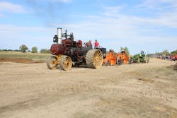 A 1918 Russell & Co. 30/90 traction engine pulls two 1920s Baker Maney D wheeled scrapers and a 1929 Galion Leaning Wheel E-Z Lift No. 10 pull grader. A 1918 Russell & Co. 30/90 traction engine pulls two 1920s Baker Maney D wheeled scrapers and a 1929 Galion Leaning Wheel E-Z Lift No. 10 pull grader.