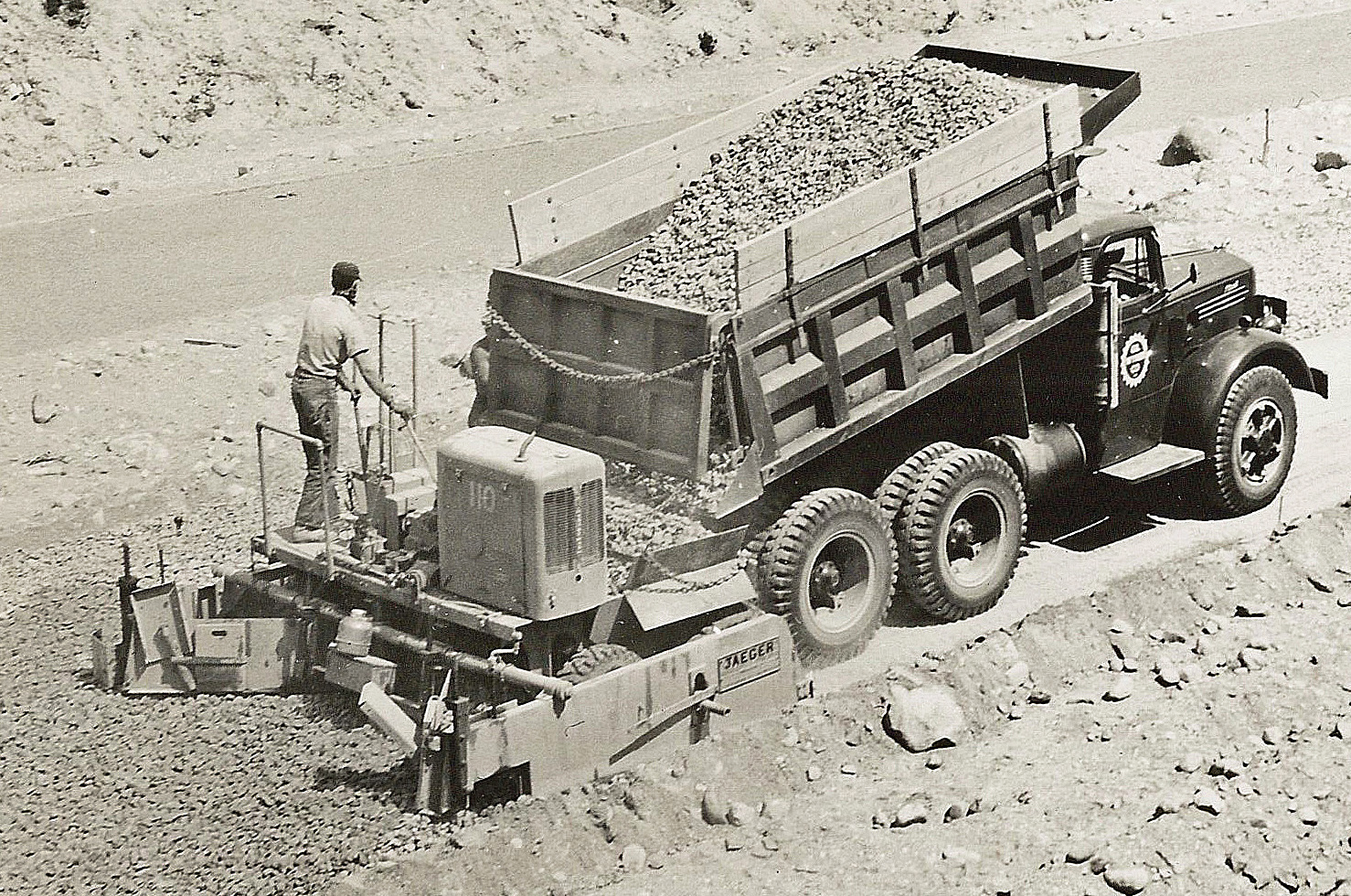 A Jaeger SPS-W series base paver lays material on part of the Pennsylvania Turnpike. The &ldquo;W&rdquo; indicates wheel mounting instead of crawlers.