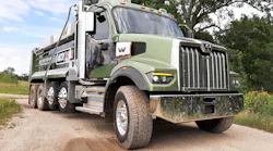 Money-green paint and geometric-decor graphics look good on the handsome 47X as it pauses after running one of two off-road courses at proving grounds outside of Detroit. The tandem and two lift axles make it a “quad” used in several states. Lenses of the cool-burning LED headlamps have heating grids to melt snow and ice. New “Daimler cab” is steel-framed, aluminum skinned, and wide enough for a crew of three. In the dump bed were 15 tons of gravel, but the truck would scale well under its rated GVW of 86,040 pounds.