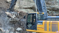 A Rutledge excavator grabs rock on a mountainside in Pennsylvania for use in a stream bed. A Rutledge excavator grabs rock on a mountainside in Pennsylvania for use in a stream bed.