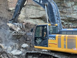 A Rutledge excavator grabs rock on a mountainside in Pennsylvania for use in a stream bed. A Rutledge excavator grabs rock on a mountainside in Pennsylvania for use in a stream bed.