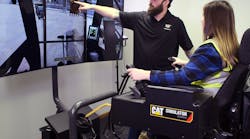 A Simformotion trainer explains how to operate an excavator effectively to a student training on a Cat Simulators system. A Simformotion trainer explains how to operate an excavator effectively to a student training on a Cat Simulators system.