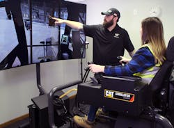 A Simformotion trainer explains how to operate an excavator effectively to a student training on a Cat Simulators system. A Simformotion trainer explains how to operate an excavator effectively to a student training on a Cat Simulators system.