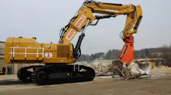 Cat 6015 excavator has a Fortress 145FS Series Mobile Shear and a custom-designed and built Pierce Pacific 3-piece boom/stick.