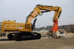 Cat 6015 excavator has a Fortress 145FS Series Mobile Shear and a custom-designed and built Pierce Pacific 3-piece boom/stick.