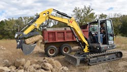 The Geith thumb and quick coupler make quick work of a stone slab. The hydraulic quick coupler is factory installed as standard equipment on the ET58. The Geith thumb and quick coupler make quick work of a stone slab. The hydraulic quick coupler is factory installed as standard equipment on the ET58.