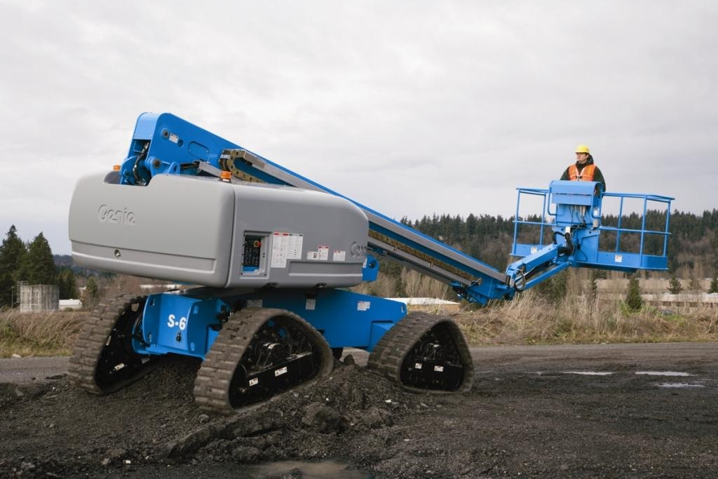 Tracks on a boom lift can help navigate rough terrain, but operation on slopes require knowing a lift's maximum slope rating and the degree of slope in the work area.