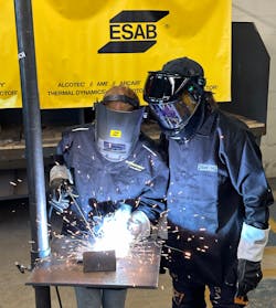 Lecanto High School senior Megan Blair (L) shows off her Stick welding skills to Ronnie Renner. Lecanto High School senior Megan Blair (L) shows off her Stick welding skills to Ronnie Renner.