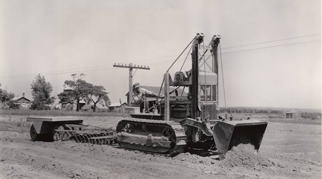 On a road job near Galva, Illinois, in September, 1938, a Cat D4 with a High Loader is spreading fill, plus towing a disc and a pneumatic roller. It also ditched, placed pipe, and cleared brush. The machine handled excavation as well, including overburden, gravel, and earth and rock cuts.