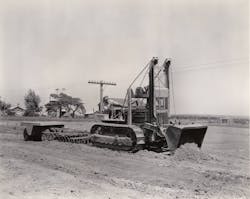 On a road job near Galva, Illinois, in September, 1938, a Cat D4 with a High Loader is spreading fill, plus towing a disc and a pneumatic roller. It also ditched, placed pipe, and cleared brush. The machine handled excavation as well, including overburden, gravel, and earth and rock cuts. On a road job near Galva, Illinois, in September, 1938, a Cat D4 with a High Loader is spreading fill, plus towing a disc and a pneumatic roller. It also ditched, placed pipe, and cleared brush. The machine handled excavation as well, including overburden, gravel, and earth and rock cuts.