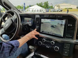 Hitch Assist, engaged by pushing and holding a circular switch, uses a rear-facing camera and computer calculations to back the truck precisely to a trailer’s tongue and place the ball beneath the waiting coupler. Hitch Assist, engaged by pushing and holding a circular switch, uses a rear-facing camera and computer calculations to back the truck precisely to a trailer’s tongue and place the ball beneath the waiting coupler.