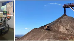 An operator (left) controls the Komatsu D375Ai-8 at the mine's stockpile.