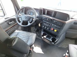 This tractor has Diamond Elite trim with leather seat covers. Instrument panel includes electro-mechanical gauges and info screens. Originally built with an aluminum cab from the old Paystar and 9900i, HX series was given a new lightweight galvanized steel cab in 2020. This tractor has Diamond Elite trim with leather seat covers. Instrument panel includes electro-mechanical gauges and info screens. Originally built with an aluminum cab from the old Paystar and 9900i, HX series was given a new lightweight galvanized steel cab in 2020.