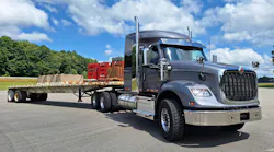 This HX620 and ballasted Doonan 48-foot steel flatbed gross at 80,000 pounds. The short 56-inch Hi-Rise sleeper can accommodate overnight stays; a tall-roof 73-incher is also available. The traditionally styled HX, complete with high flat face and dual air cleaners, is primarily a vocational model but can be spec’d as a highway tractor. This vehicle has features of both.