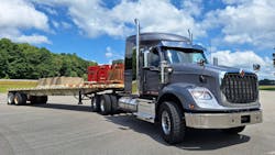 This HX620 and ballasted Doonan 48-foot steel flatbed gross at 80,000 pounds. The short 56-inch Hi-Rise sleeper can accommodate overnight stays; a tall-roof 73-incher is also available. The traditionally styled HX, complete with high flat face and dual air cleaners, is primarily a vocational model but can be spec’d as a highway tractor. This vehicle has features of both. This HX620 and ballasted Doonan 48-foot steel flatbed gross at 80,000 pounds. The short 56-inch Hi-Rise sleeper can accommodate overnight stays; a tall-roof 73-incher is also available. The traditionally styled HX, complete with high flat face and dual air cleaners, is primarily a vocational model but can be spec’d as a highway tractor. This vehicle has features of both.