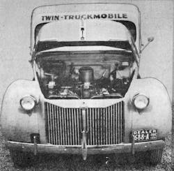A look under the twin Ford hood of a Twin Truckmobile. The Road Show was the place to show new equipment, but note the 1941 dealer plate.