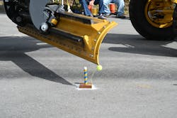 A Motor Grader Blade Knocks Over A Ball A Motor Grader Blade Knocks Over A Ball