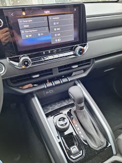 Headlight controls are not on a switch, but on the large multifunction center screen. The normal paddle shifter includes thumb switch for manual down- and upshifting while in Low. A round knob controls 4x4 functions. Headlight controls are not on a switch, but on the large multifunction center screen. The normal paddle shifter includes thumb switch for manual down- and upshifting while in Low. A round knob controls 4x4 functions.