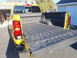 The bed is 5.5 feet long, but it holds longer items with the tailgate down. The interior side of the gate has a compartment for jumper cables, hitch, a can of motor oil, and whatever else an owner wants to take along. A 48-inch rule is embossed along the gate&rsquo;s outer edge.