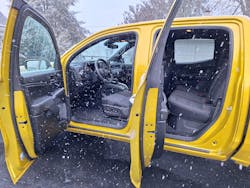 Seen through a snow shower, the four-door crewcab is the only cabin available in the Colorado and GMC Canyon. The floor is 22 inches high, making entry difficult for short-legged people. All-black interior includes cloth seat covers and hard plastic panels.