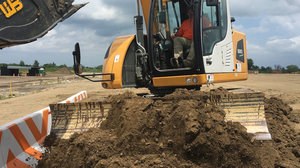 Both power and precision can be achieved with an integrated dozer blade mounted on an excavator.