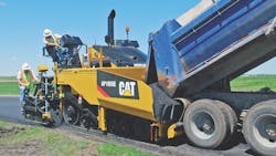 One of the key decisions to be made is propulsion method: tracks or wheels. Tracked pavers like this older Cat model are better on steep terrain than wheeled pavers.