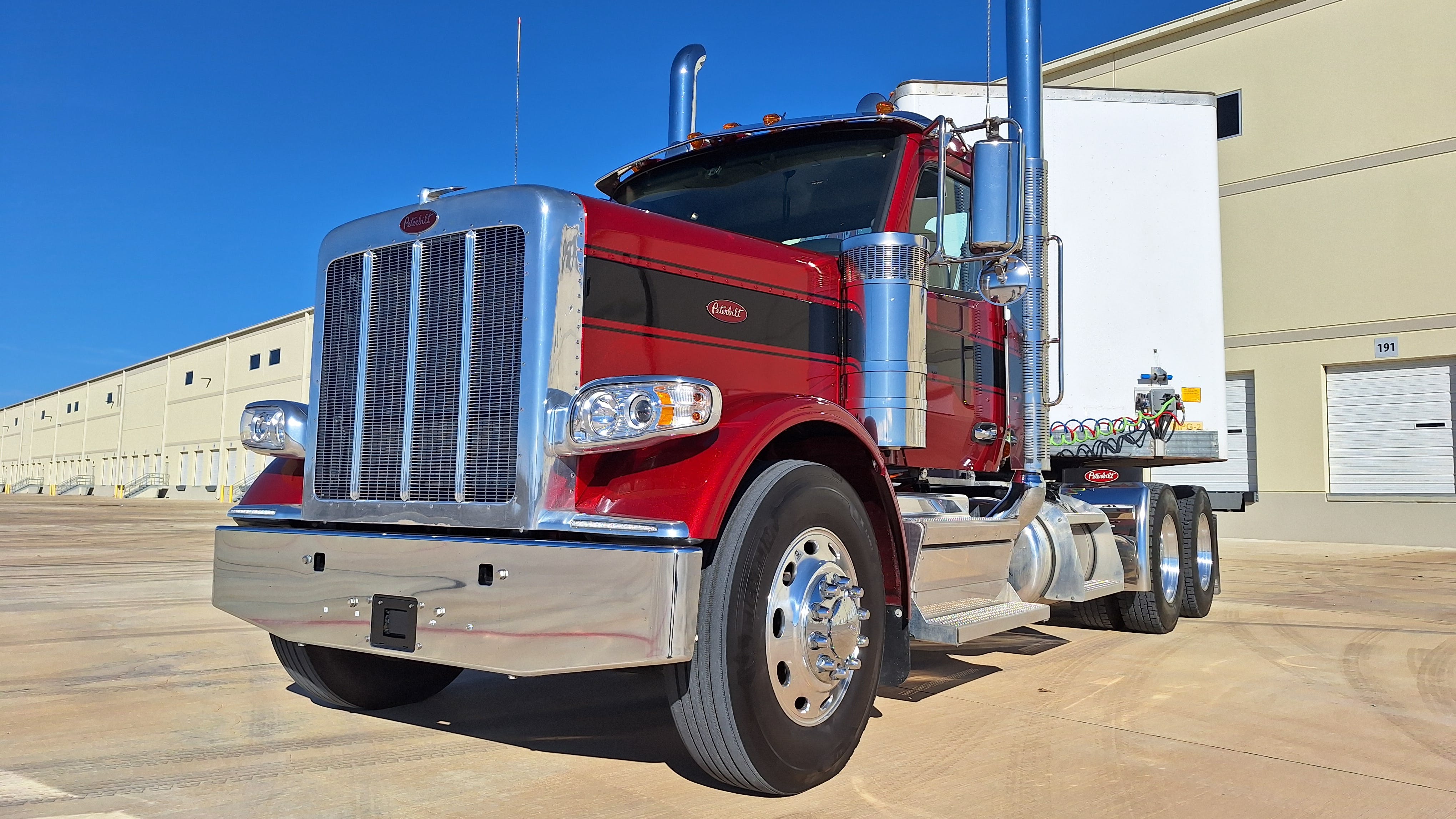 Model 589 daycab tractor in &ldquo;legendary&rdquo; red with a black band looks handsome and purposeful, but closely resembles previous models. That is exactly what customers said they wanted and what Peterbilt designers gave them. The main change is the 2.1-meter-wide aluminum cab that&rsquo;s 8 inches broader than the cabin on the 389, which now is out of production. Like older &ldquo;Petercars,&rdquo; the 589 can be outfitted for highway and on/off-road vocational duties.
