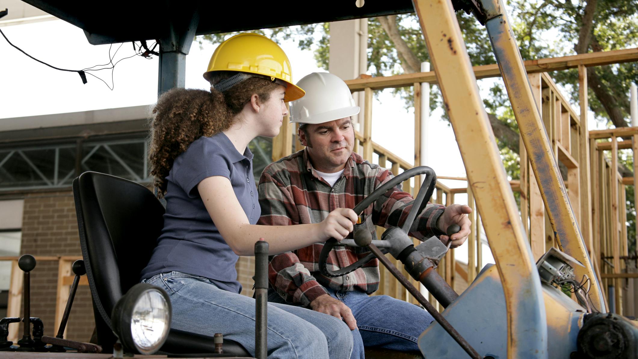 Pre-apprenticeship programs in equipment operation allow students to experience hands-on training in the field, such as that depicted here.