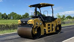 CB10 compact roller completing a pass on a fresh asphalt mat. CB10 compact roller completing a pass on a fresh asphalt mat.