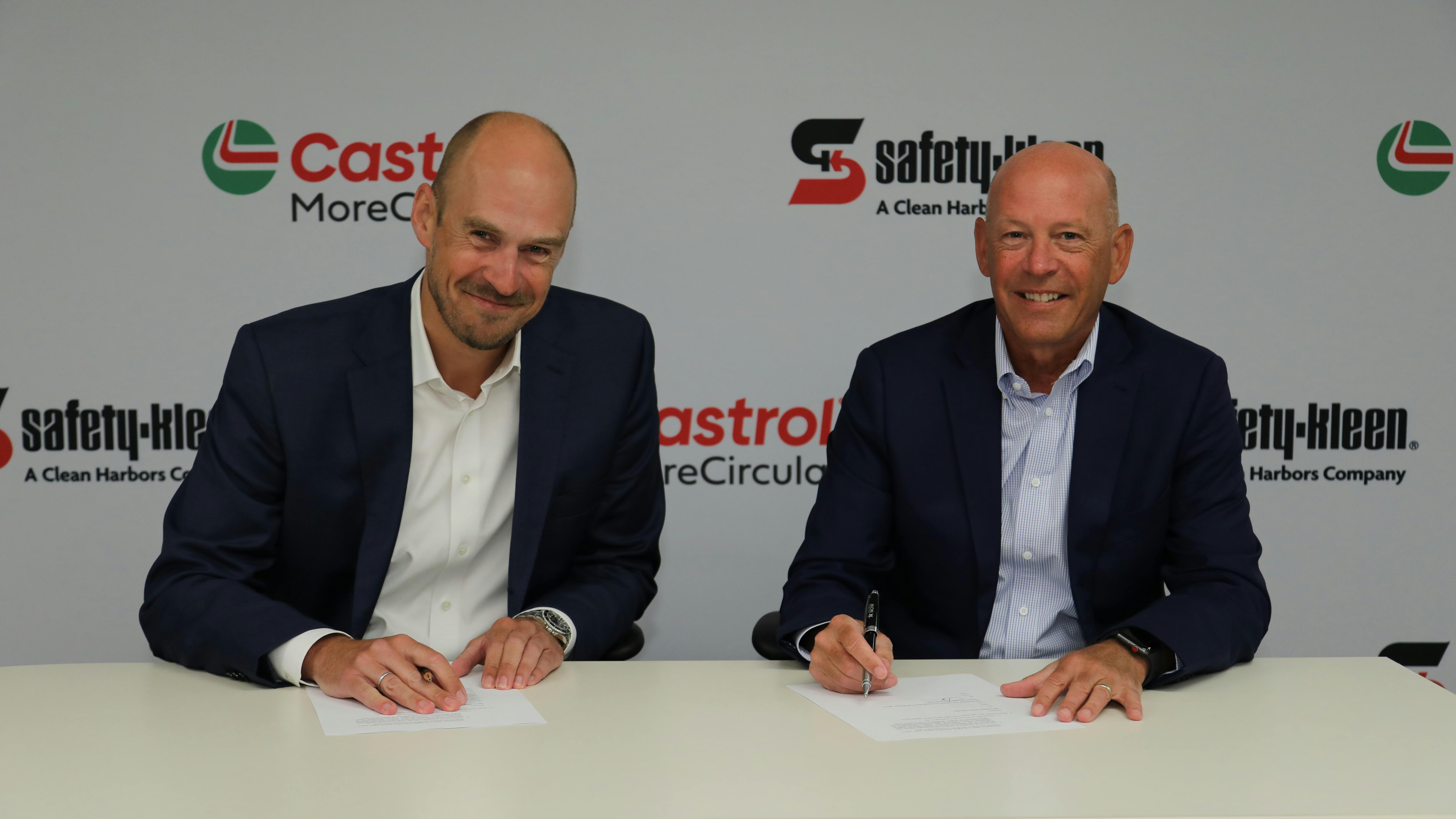 Andreas Osbar, CEO of Castrol Americas (left) and Brian Weber, President of Safety-Kleen Sustainability Solutions, a segment of Clean Harbors, Inc., sign the partnership agreement.