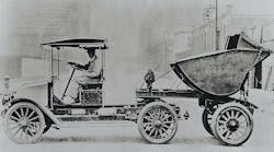 Model H tractor pulling a concrete dump body. Model H tractor pulling a concrete dump body.