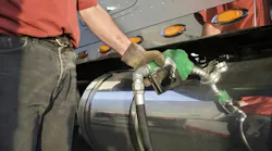 Man Pumping Renewable Gas into Semi