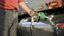 Man Pumping Renewable Gas into Semi Man Pumping Renewable Gas into Semi