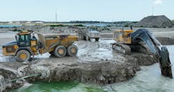 Tomahawk&rsquo;s Teleo enabled articulated dump trucks ready to be loaded by an excavator in Naples, Florida.