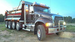 Mack’s latest Granite looks much like the original version did upon its 2005 introduction, though numerous updates have been applied. All exterior lights, including headlamps, are LEDs. When the forward-set steer axle’s wheel stops are properly adjusted, turning radius is almost as tight as with a setback steer axle’s. Copious amounts of bright-metal trim and custom gray-and-red paint mark this as a show truck, but it’s capable of some serious work. Mack’s latest Granite looks much like the original version did upon its 2005 introduction, though numerous updates have been applied. All exterior lights, including headlamps, are LEDs. When the forward-set steer axle’s wheel stops are properly adjusted, turning radius is almost as tight as with a setback steer axle’s. Copious amounts of bright-metal trim and custom gray-and-red paint mark this as a show truck, but it’s capable of some serious work.