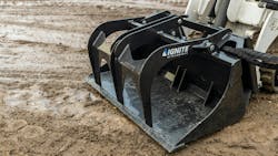 Up close of bucket grapple attachment. Up close of bucket grapple attachment.