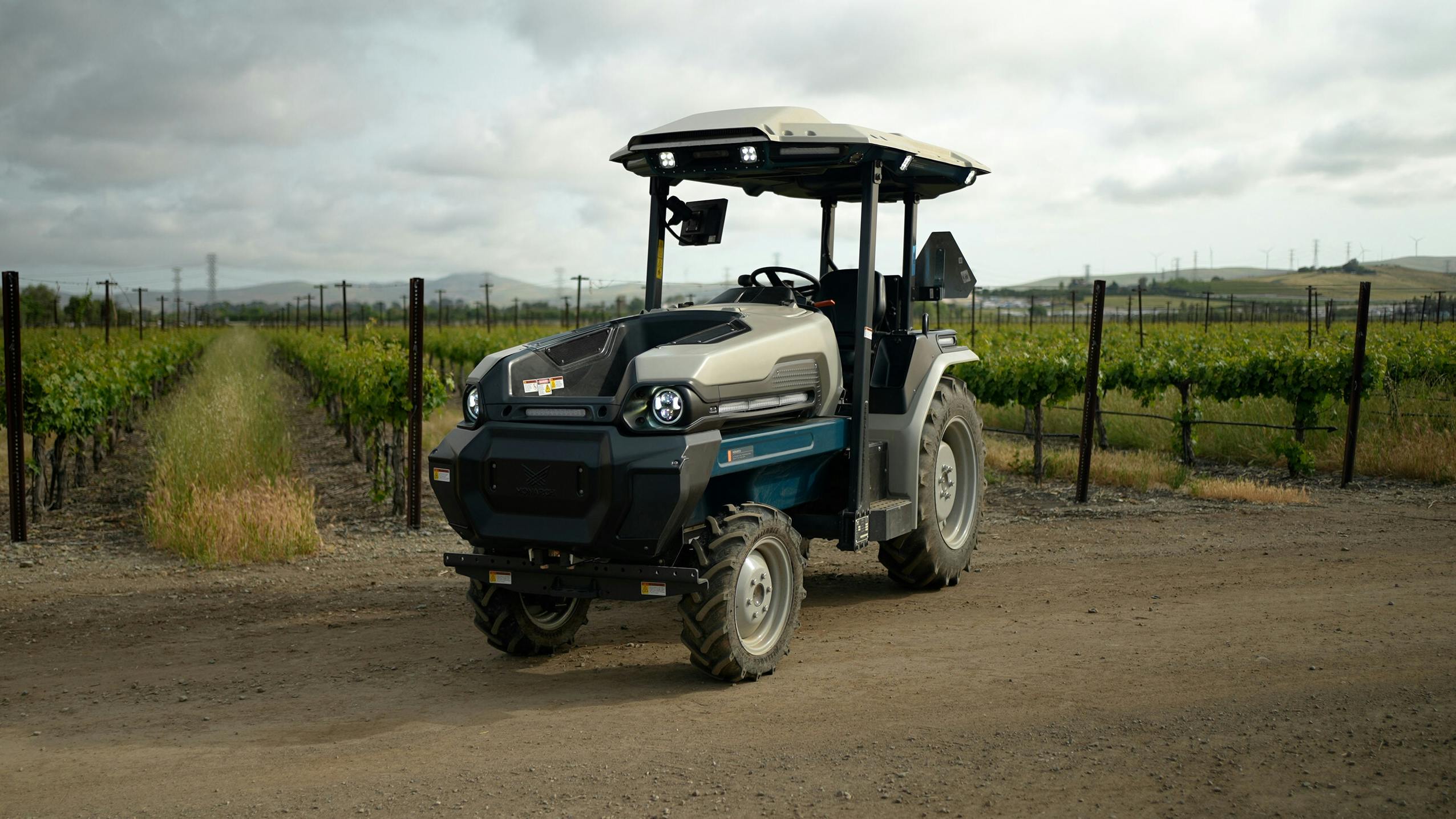 Monarch Tractor's MK-V all electric tractor with autonomous and data driven features. Utilized in specialty crops such as orchards, vineyards and also used for land management.