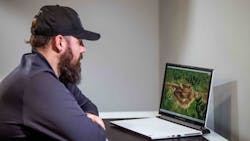 A heavy equipment operator trainer uses the Manager’s Workstation to watch three trainees learn how to work together as they operate. A heavy equipment operator trainer uses the Manager’s Workstation to watch three trainees learn how to work together as they operate.
